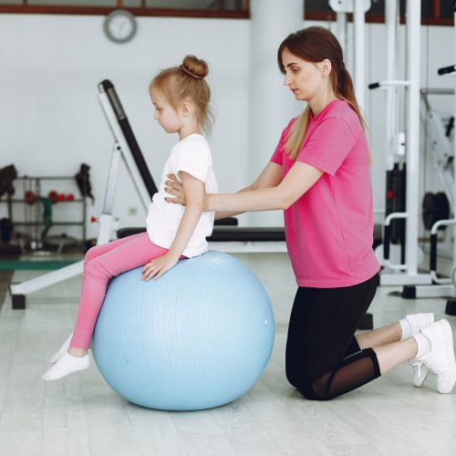 mother-with-little-daughter-are-engaged-gymnastics-gym